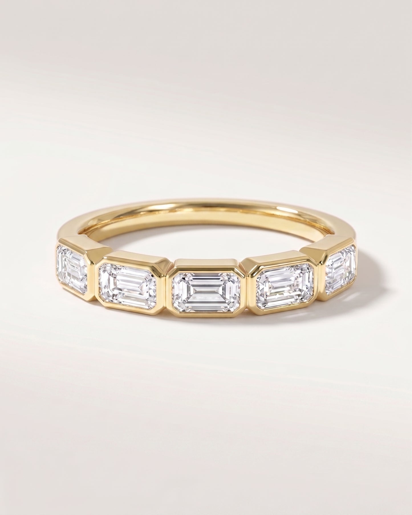 East West Bezel Emerald Half Eternity