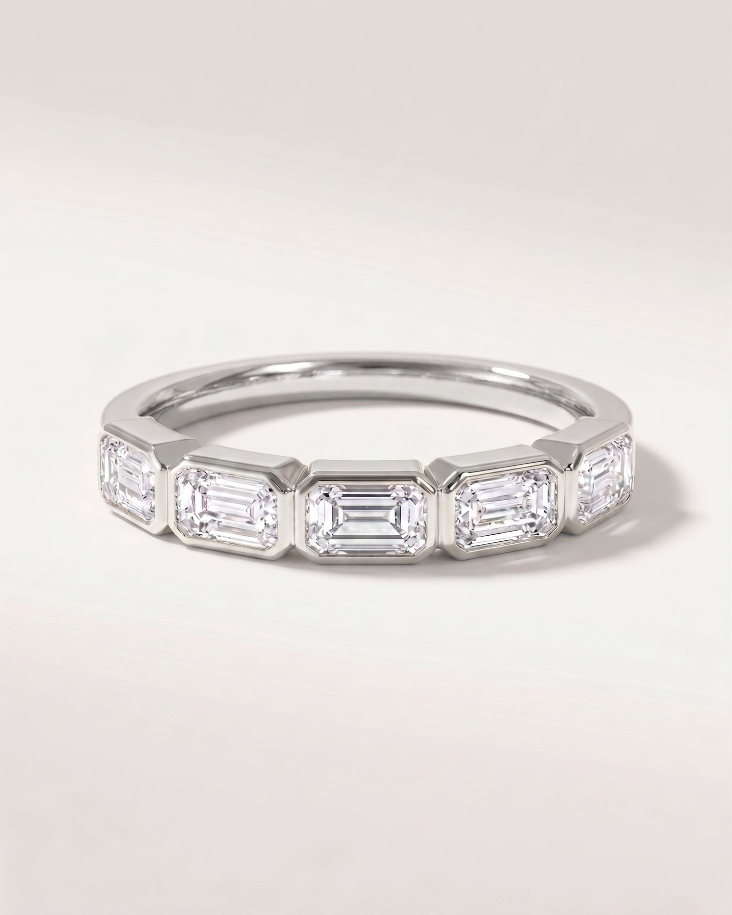East West Bezel Emerald Half Eternity